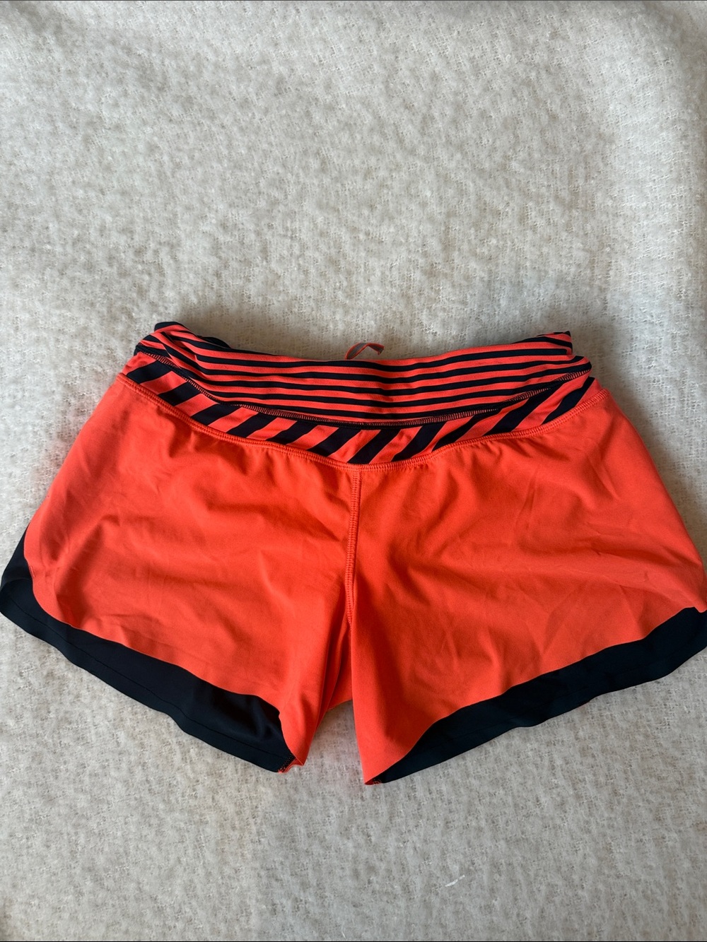 lululemon athletica orange and navy shorts